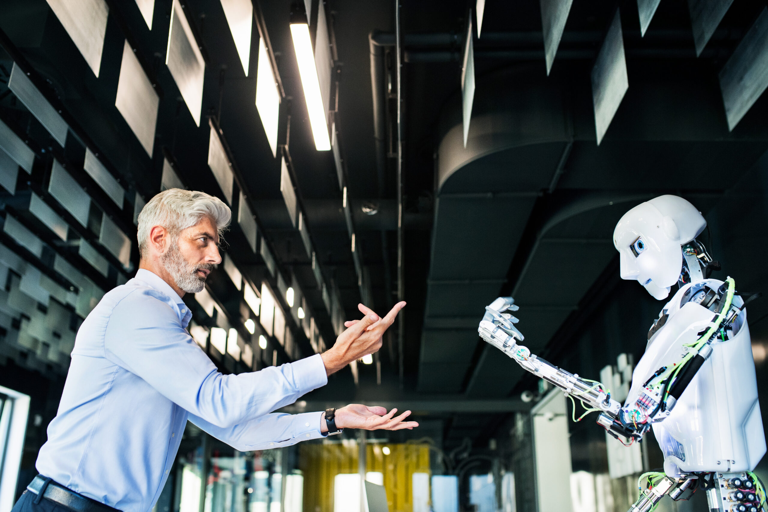 A business development professional interacting with a robot